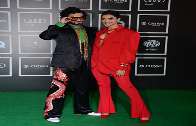 Ranveer Singh in dragon pants and Deepika Padukone in red outfit