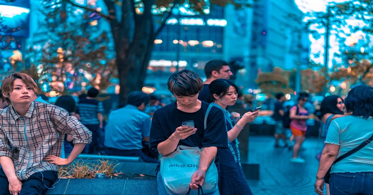 Group of people using phones
