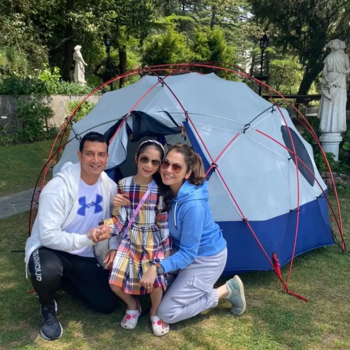 Isha Koppikar with her husband timmy narang and her daughter