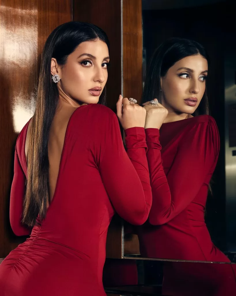 Nora Fatehi Sets the Red Carpet Ablaze: A Glamorous Affair in Ruby Red Maxi Dress